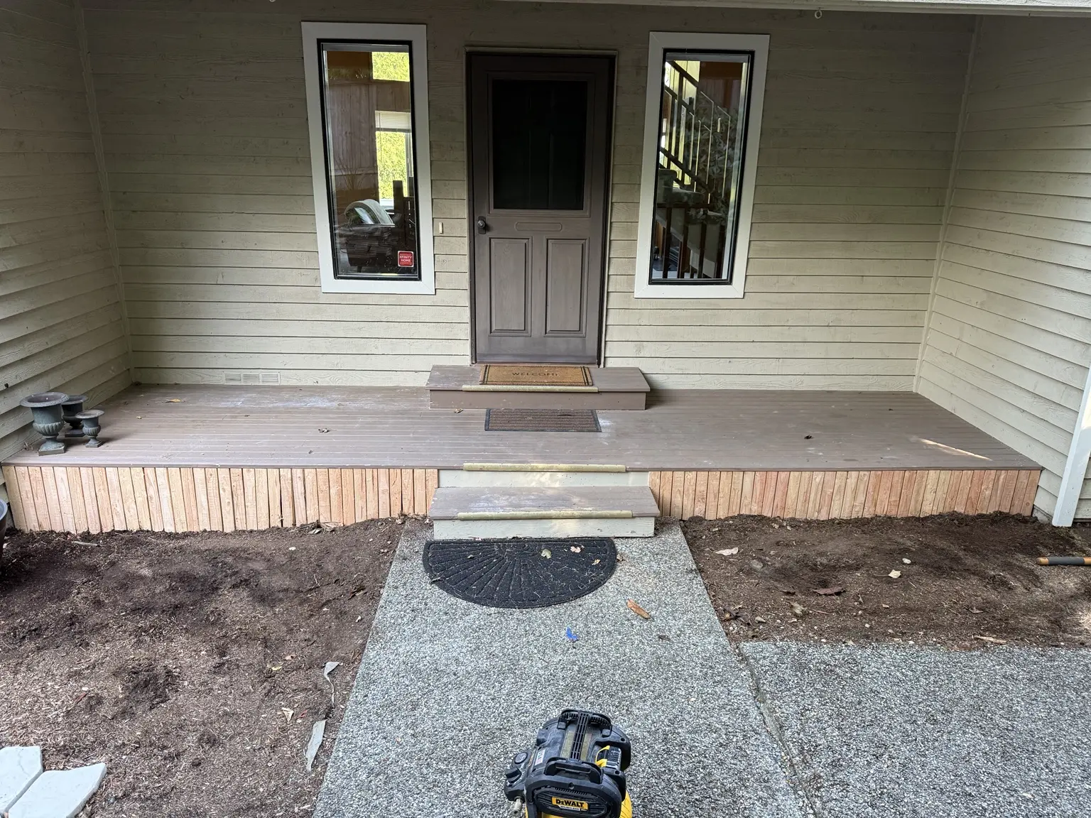 Original porch surface, lattice and steps before the color change