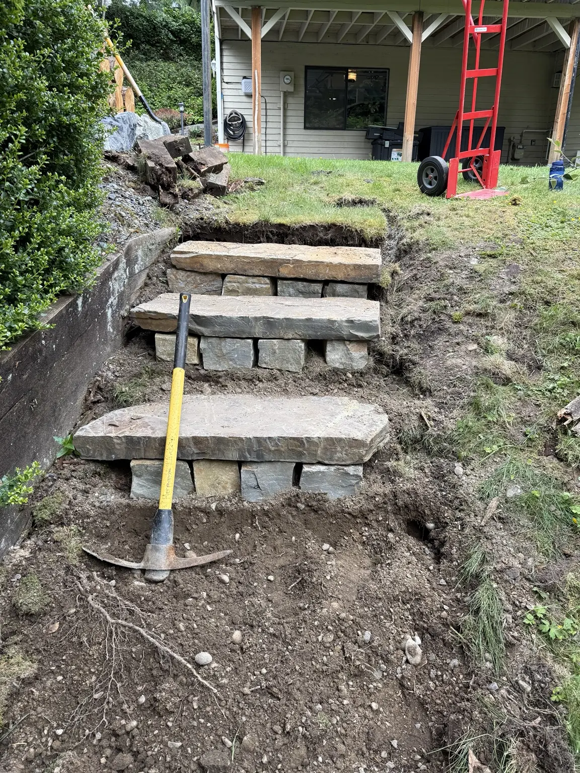 Early construction of large natural stone steps cut into the hillside